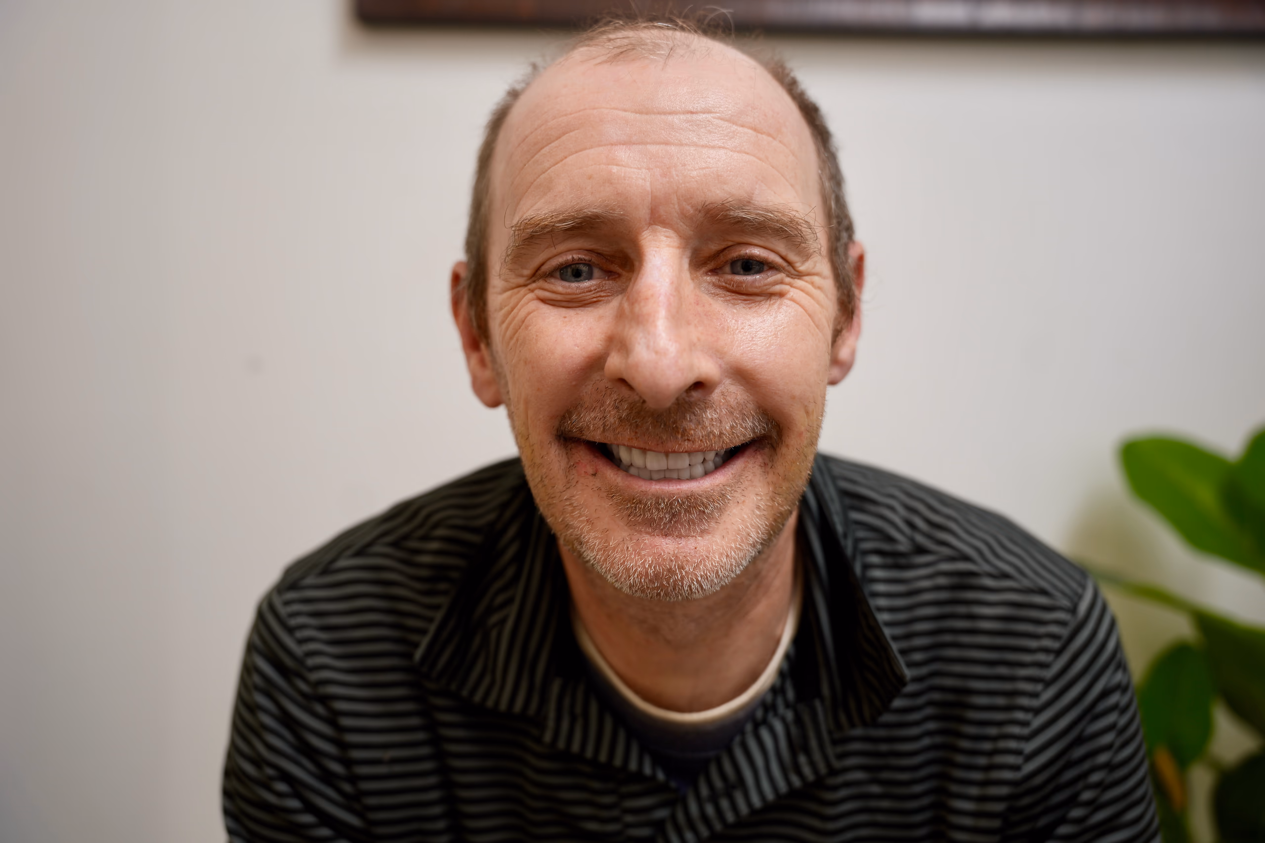 Full-arch zirconia implant bridge photographed in the studio